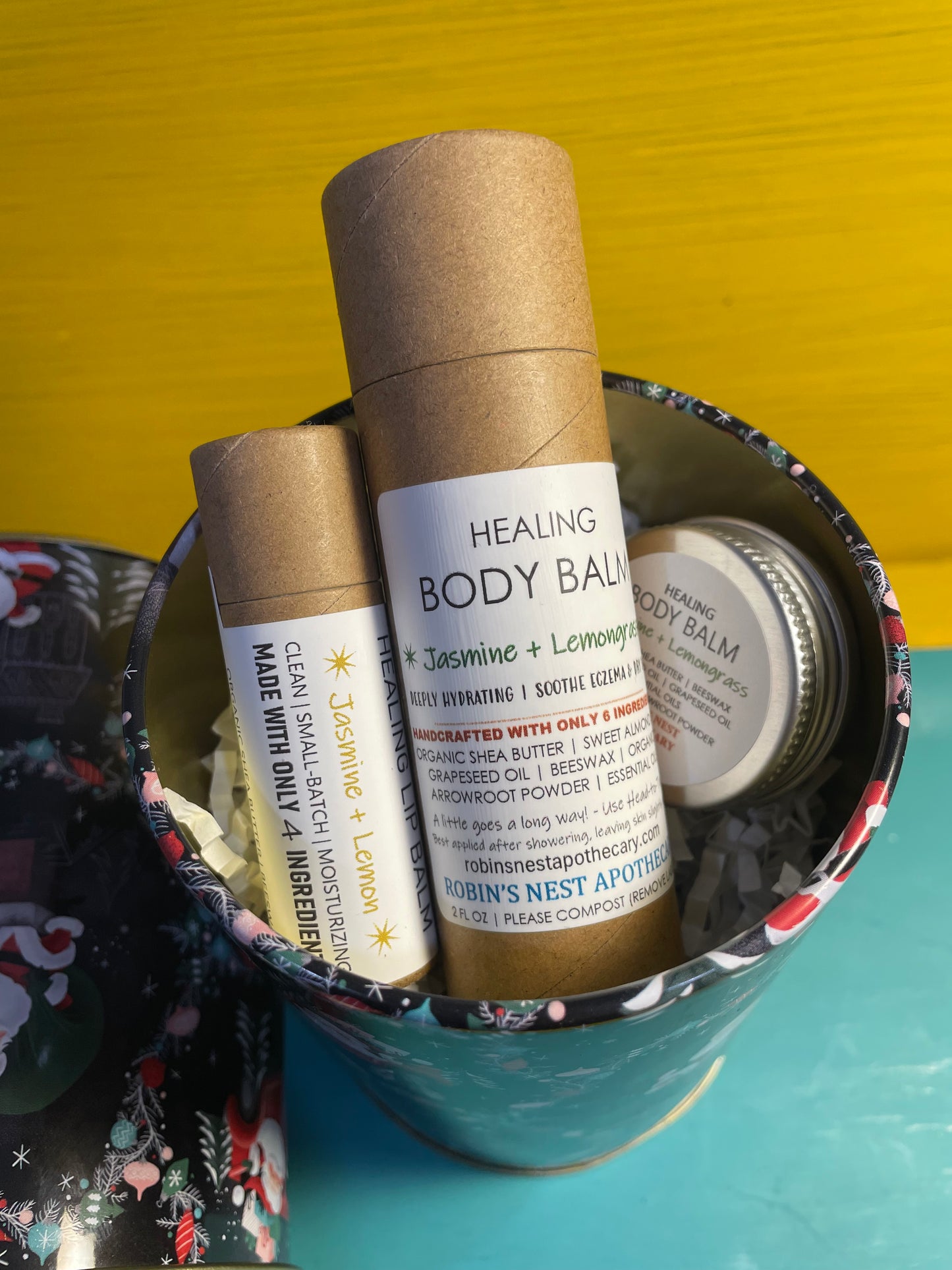 JASMINE + LEMONGRASS 3-Pack Gift Set | 2 Jasmine + Lemongrass Body Balms (2 oz Cardboard Tube + Mini Tin) + Compostable Lip Balm | Festive Cylindrical Santa + Chimney TIN | Christmas Gift | Gift Sets
